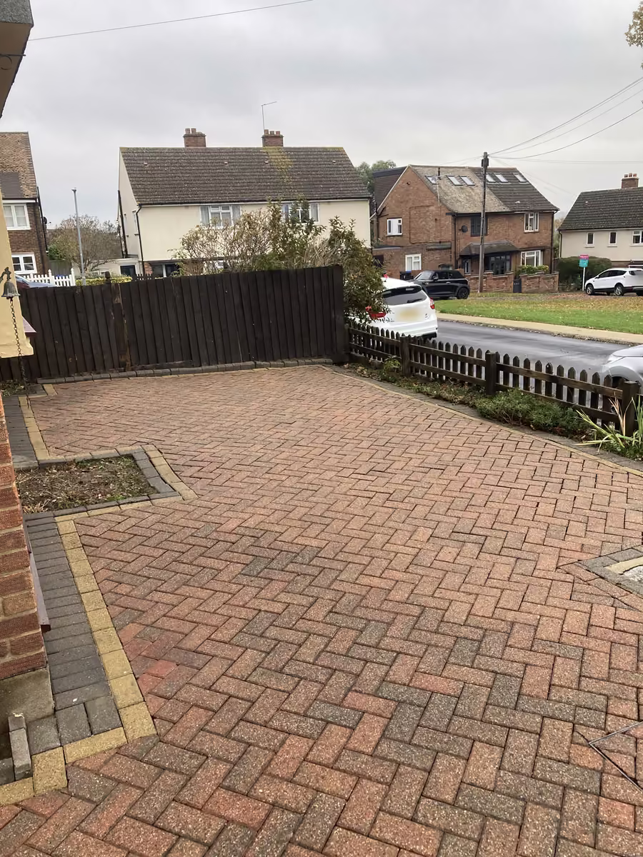 Same block paving driveway restored to clean red brick after Just Jets pressure washing